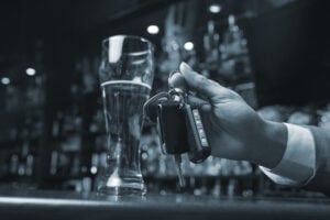 Bartender holds on to keys of an overly intoxicated person. 