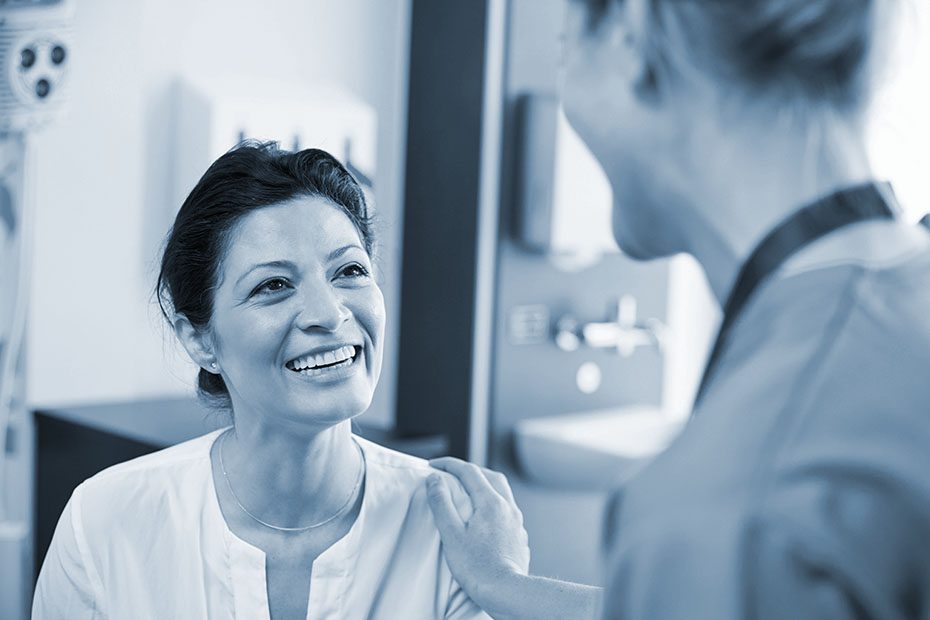 Female patient being reassured by a doctor after an accident