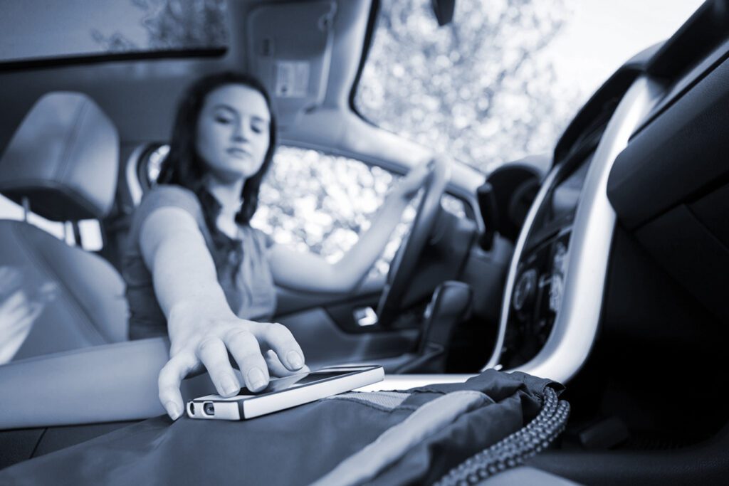 Teen driver distracted reaching for phone