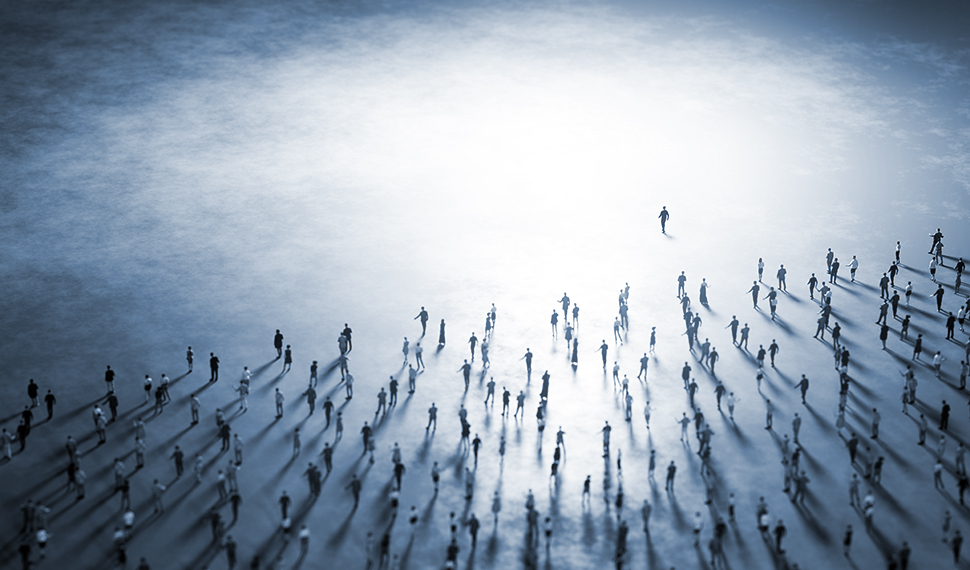 People walk from darkness into light