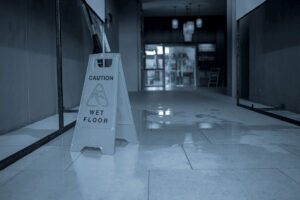Caution: Wet Floor Sign blocks a spill to precent slip and fall accidents
